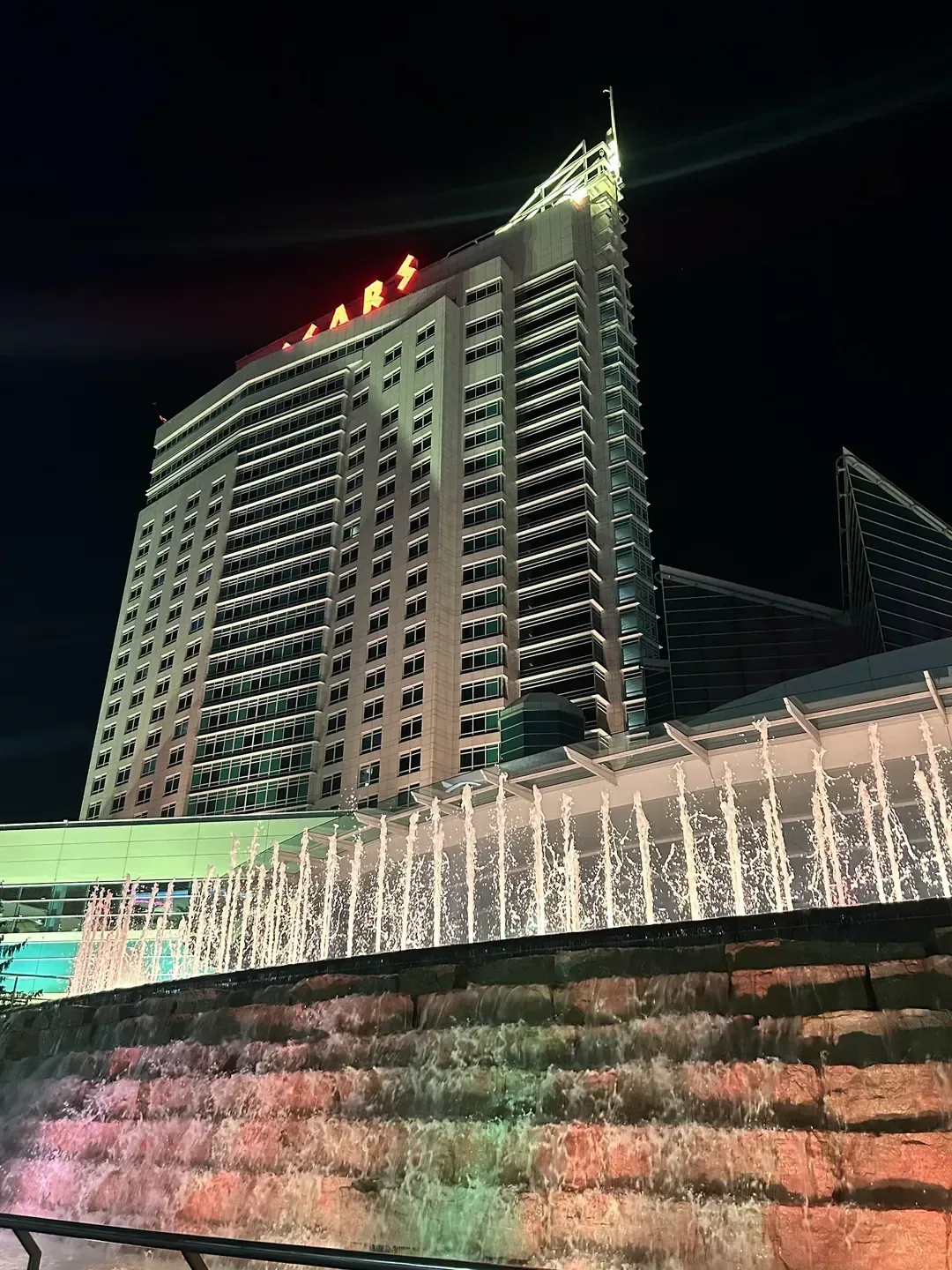 Caesars Windsor, Windsor — the hotel tower at night above the riverfront fountains